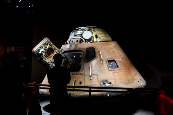 In otherworldly chiaroscuro the Apollo Command Module sits. A thing from another world. In fact.